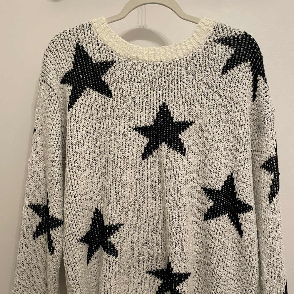 Altar’d state white sweater with black stars! Worn only once.